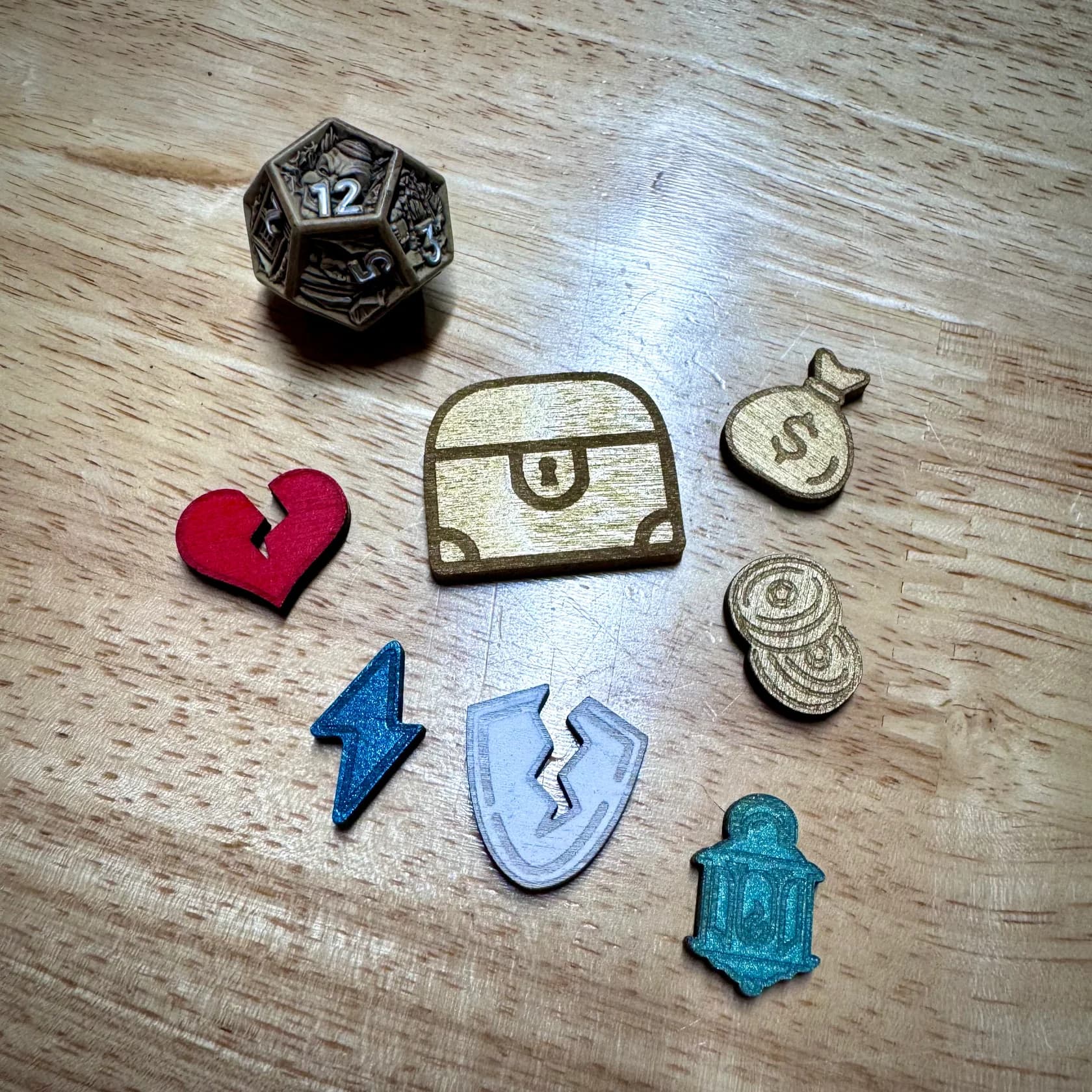 Painted wooden Daggerheart tokens spread across a table